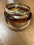 Water resistant set of 3 acrylic gold and brown bangles