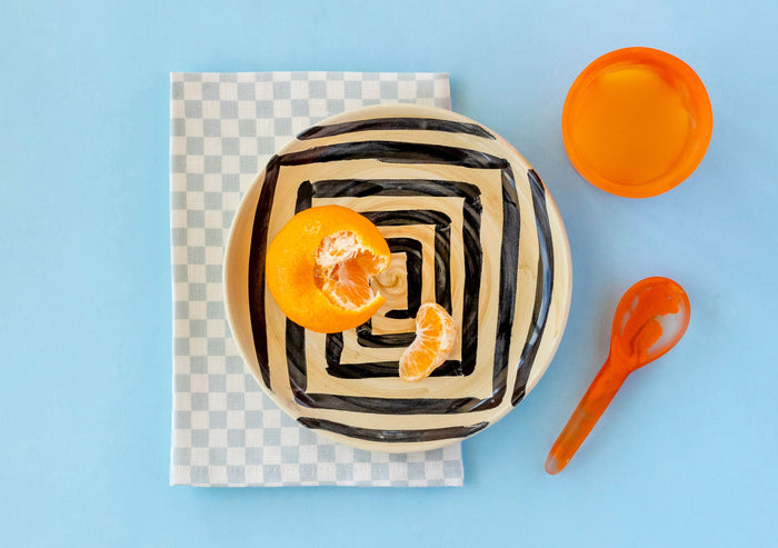 jumbled Robert Gordon hand painted ceramic side plate black geometric maze design cream background